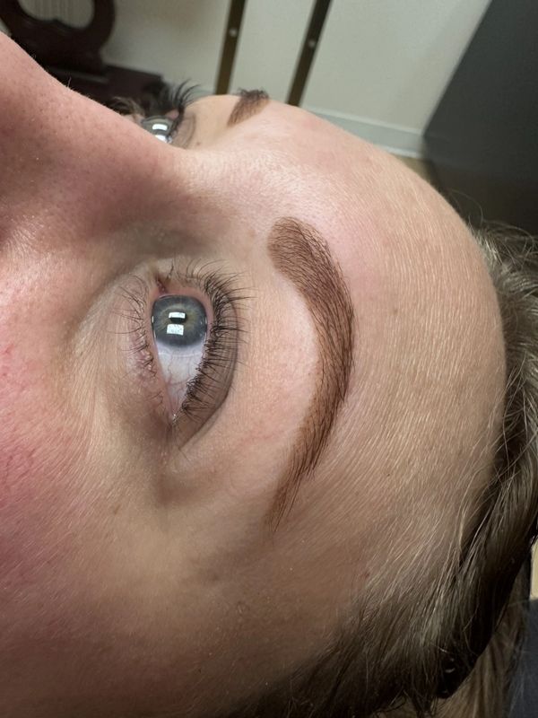 After — Light, patchy brows transformed into a bold, beautifully arched shape.