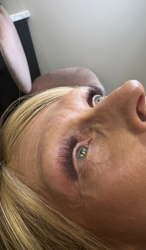 After — Bare, sparse natural lashes transformed with custom extensions for soft, flattering definition.