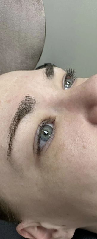 Before — Fine, light lashes built up into full, fluttery volume extensions.