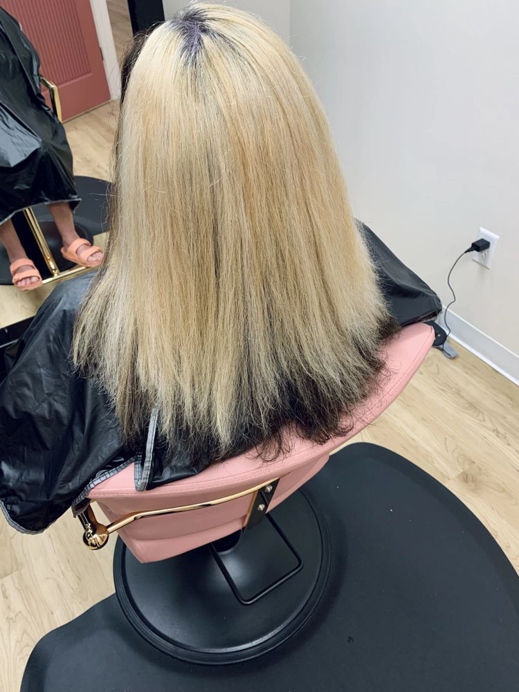 After — Dry, frizzy blonde lengths transformed into smooth, sleek shine with a smoothing treatment.