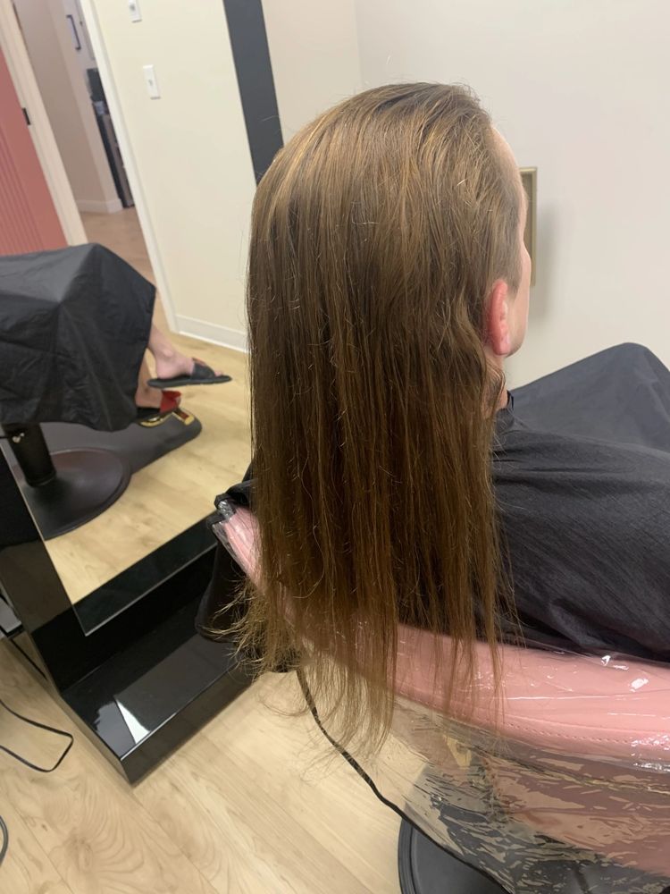 After — Coarse, unruly waves calmed into glass-smooth, silky strands after a keratin service.