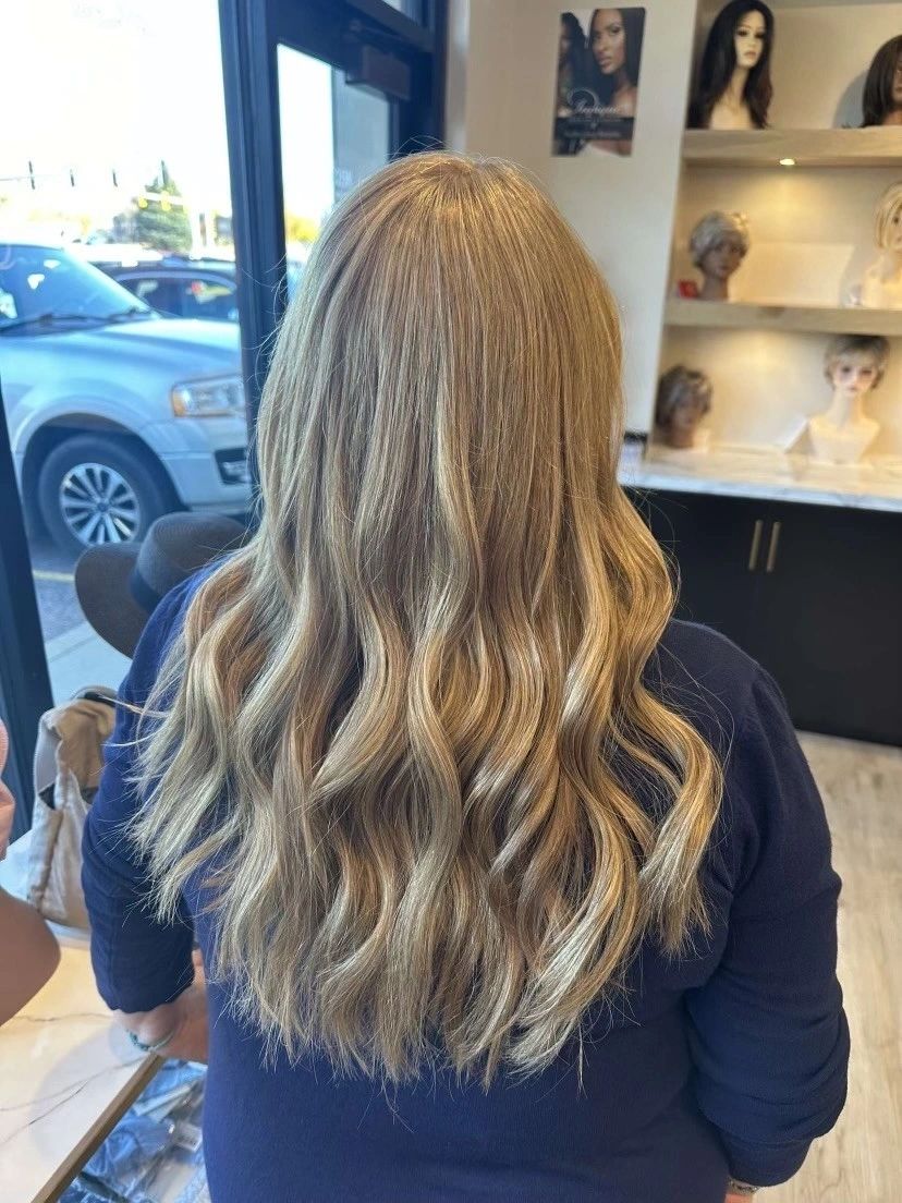 After — Flat, fine ends restyled into long, dimensional beach waves.
