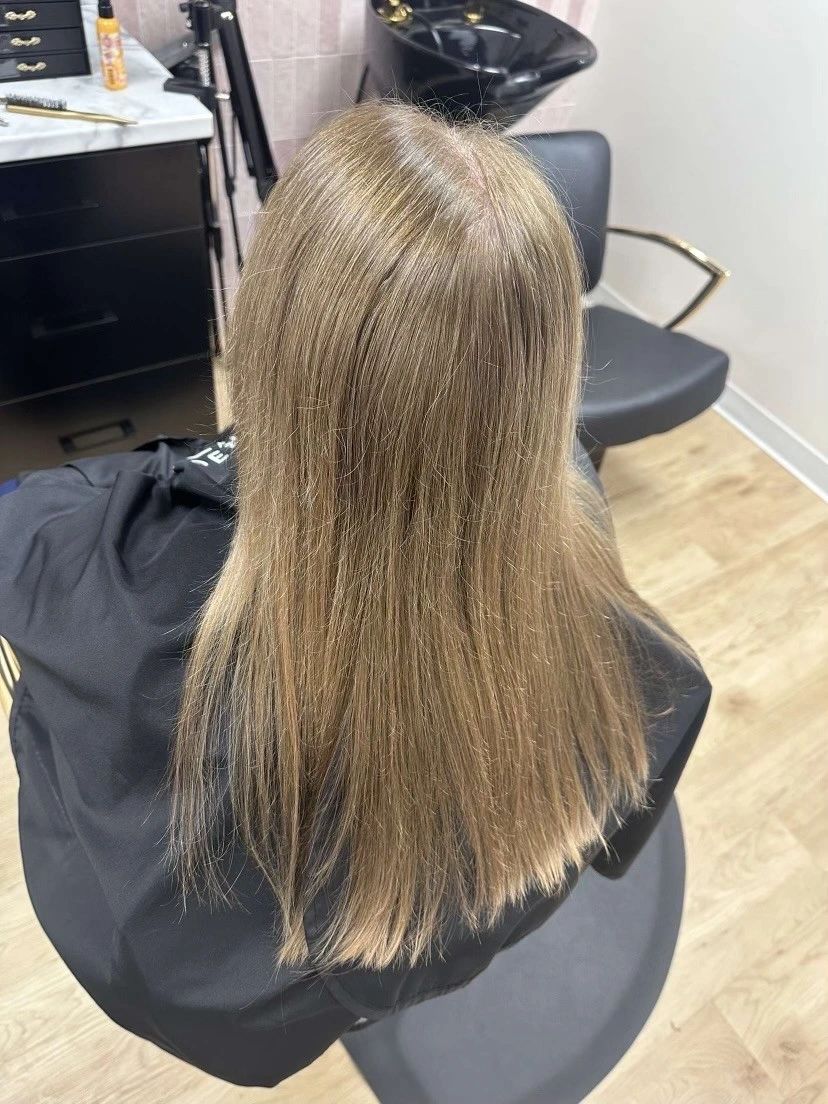 Before — Flat, fine ends restyled into long, dimensional beach waves.
